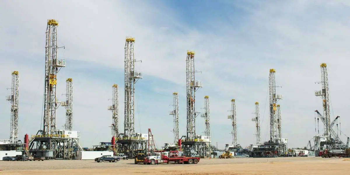 Drilling rigs and associated equipment in an industrial yard